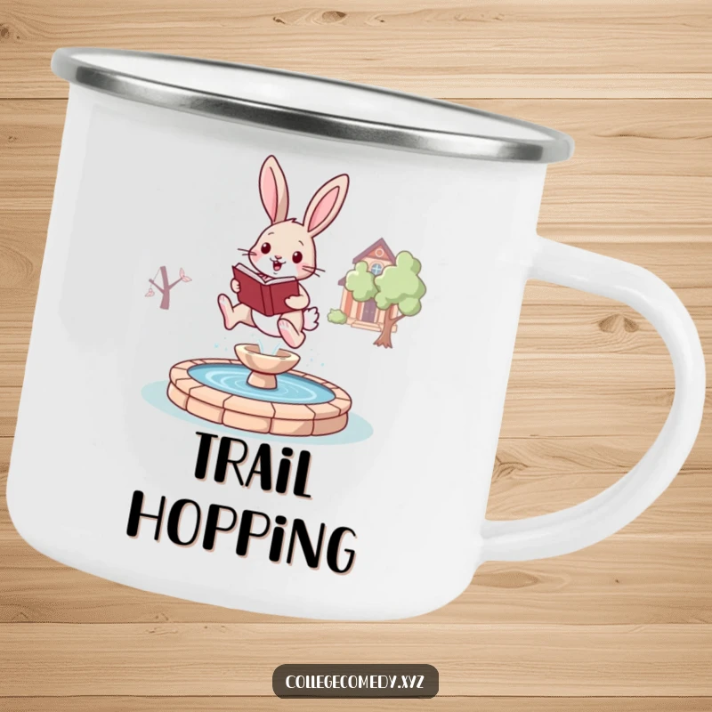 Funny bunny campus camping mug with a joyful bunny holding a book, leaping over a stylized fountain, for outdoor study.