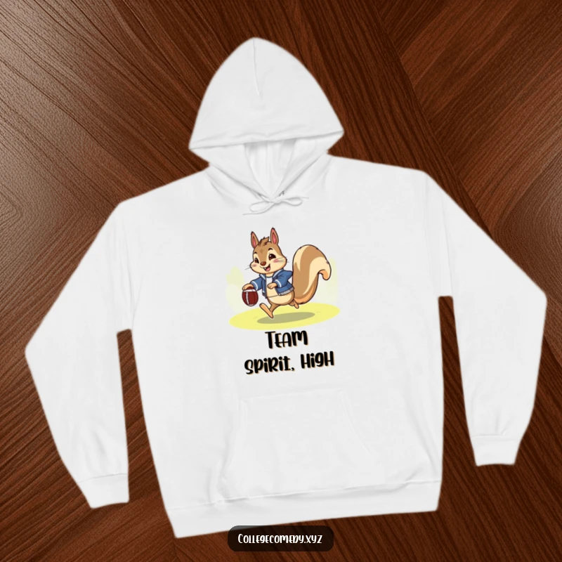 Funny squirrel football hoodie featuring an enthusiastic squirrel in a letterman jacket, happily kicking a tiny football, cozy and sporty.
